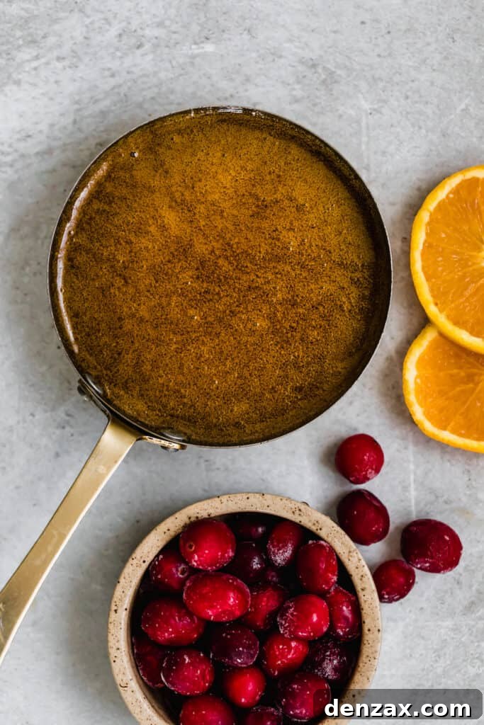 A Pan Filled with Homemade Brown Sugar Glaze Beside a Bowl of Fruit