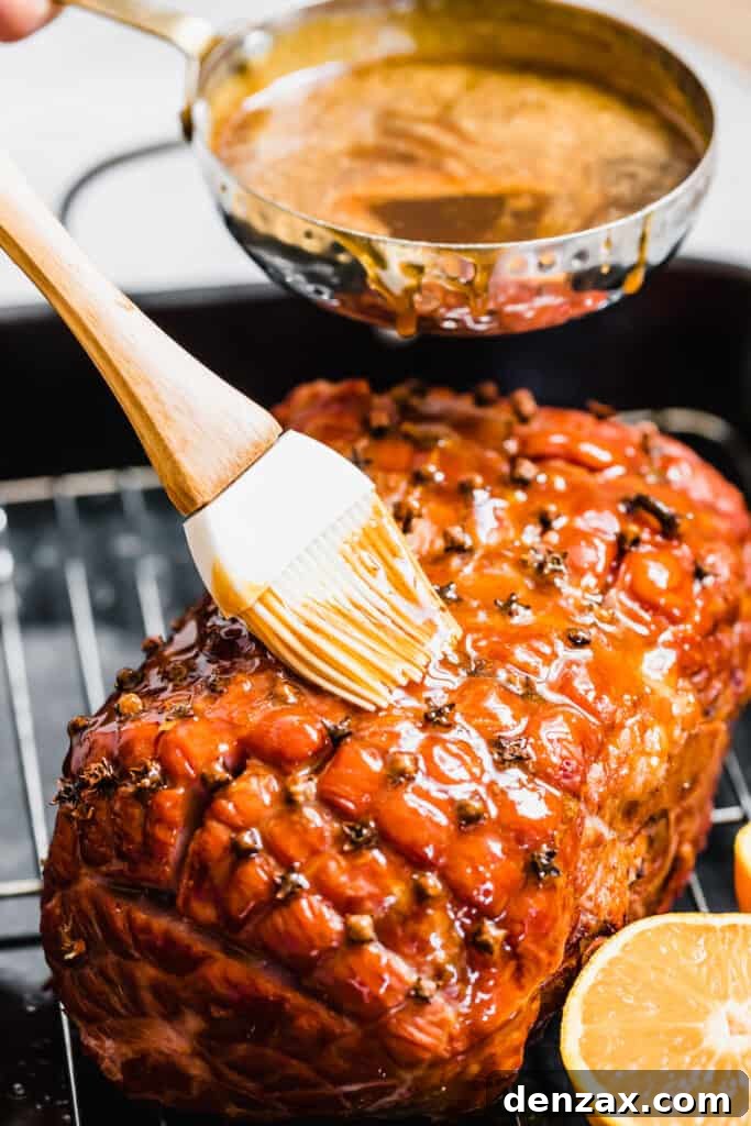 Pouring and Brushing Brown Sugar Glaze Over the Ham