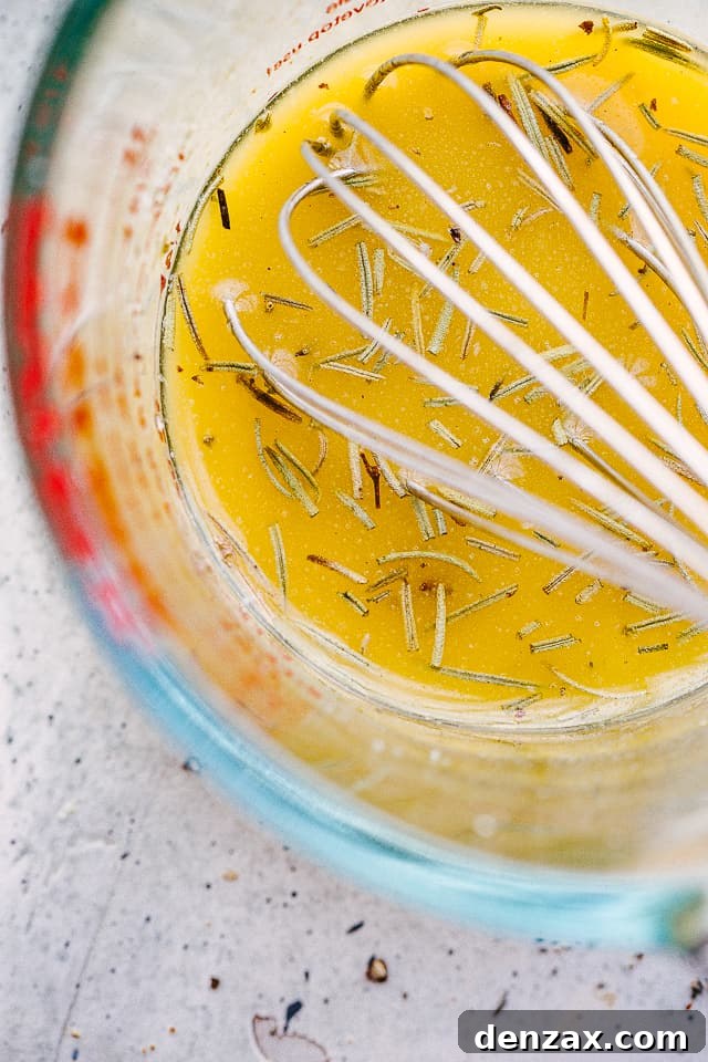 whisking sauce in a large glass cup