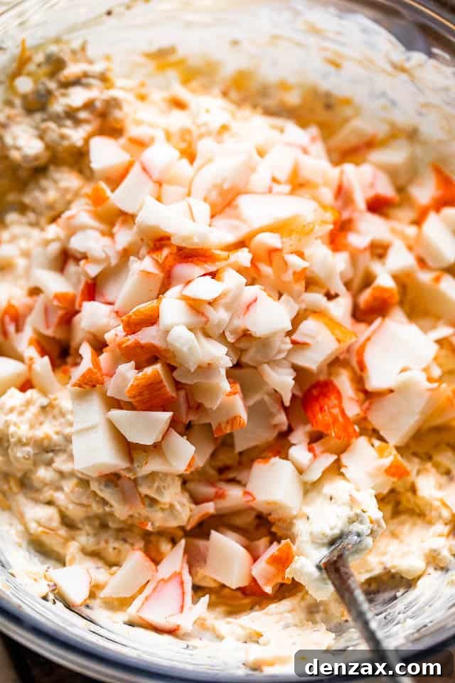 mixing crab meat into cream cheese