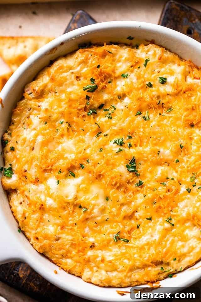 overhead shot of a white skillet with cooked crab dip