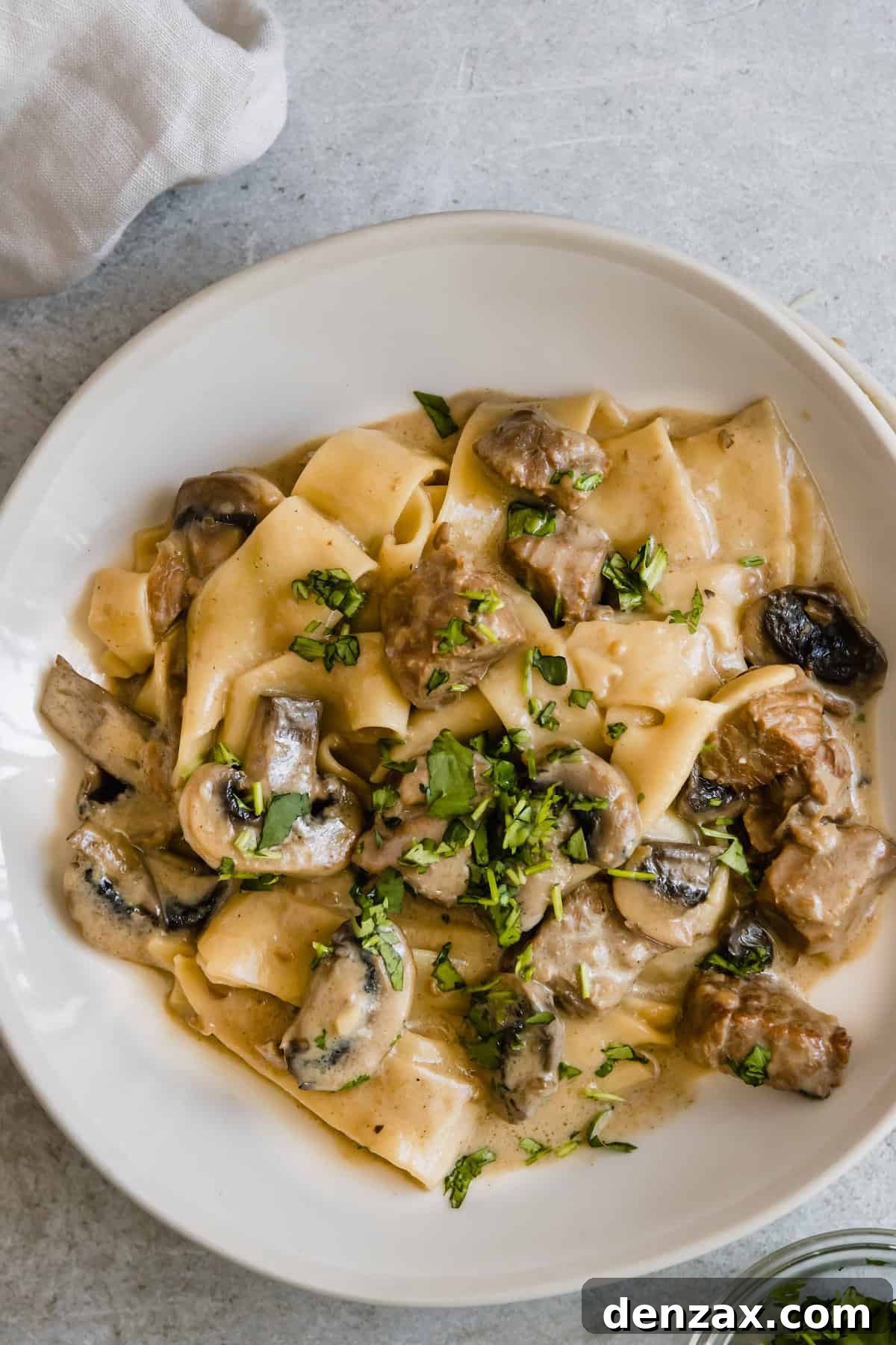 A Plate of Beef Stroganoff Garnished with Fresh Parsley