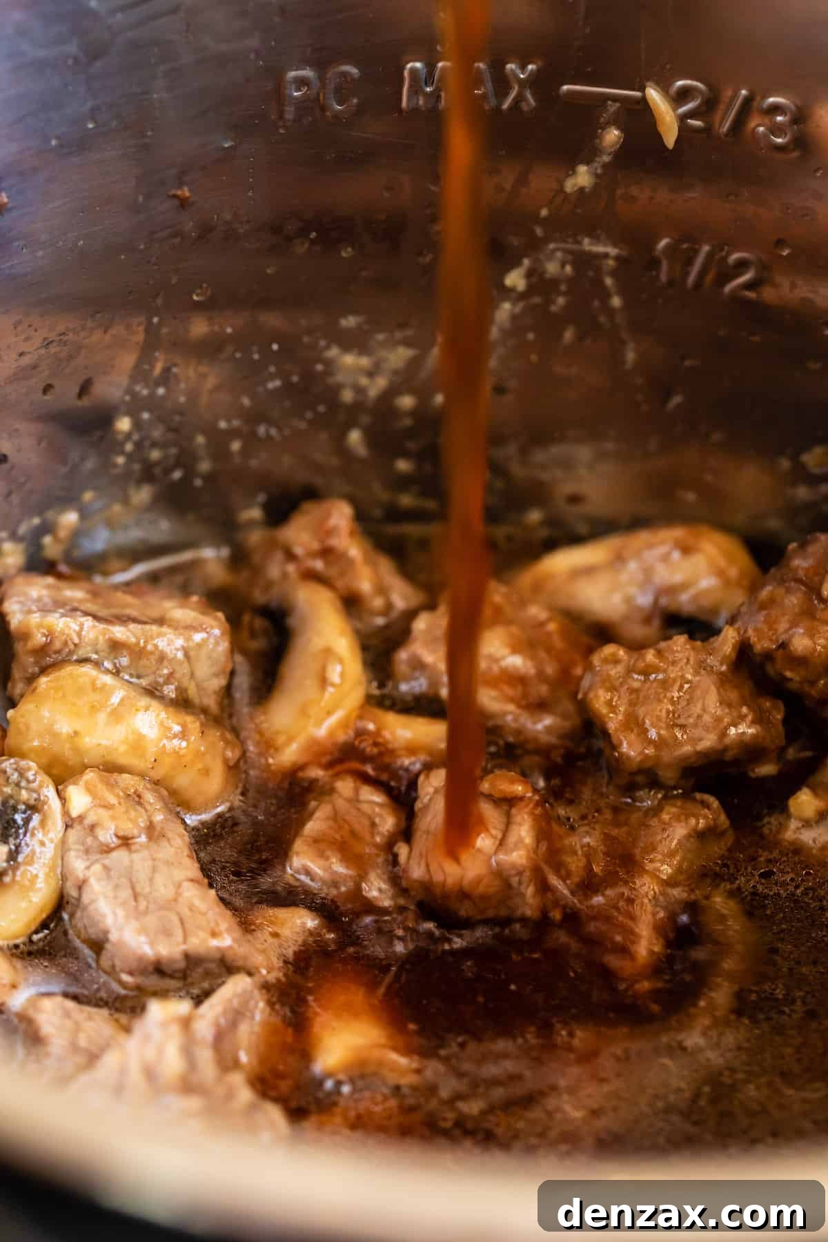 Beef Broth Being Added to the Instant Pot Bowl