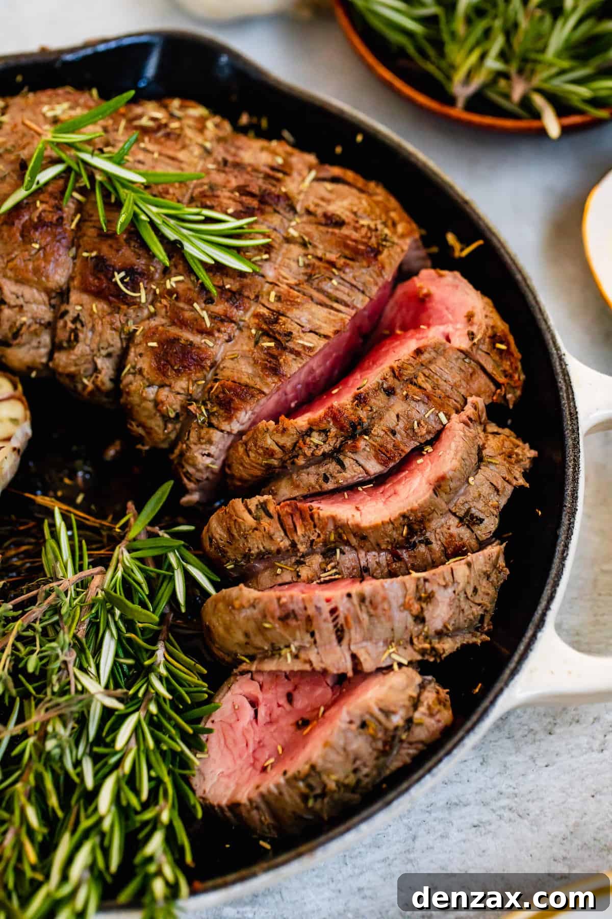 Slices of Homemade Roast Beef Tenderloin Inside a Metal Skillet