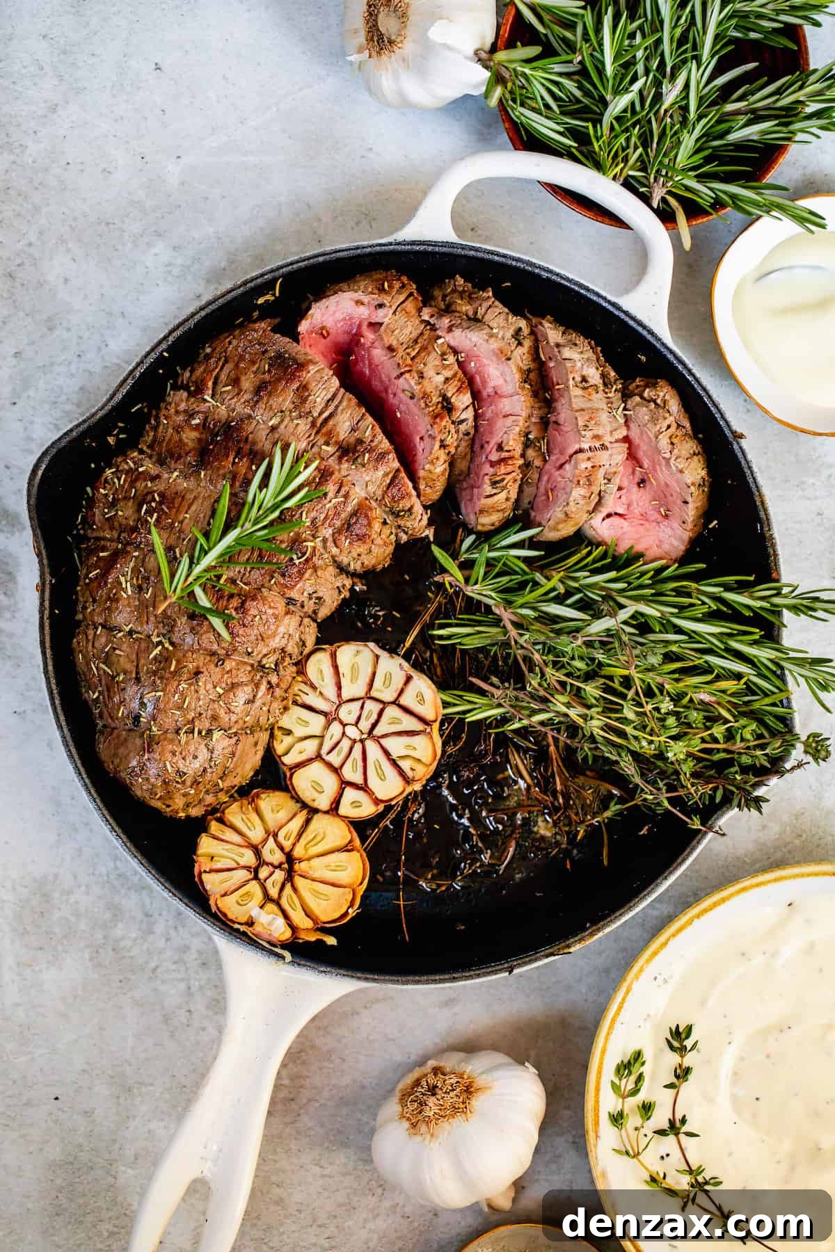 A White Skillet Containing the Cooked Beef and its Garnishes