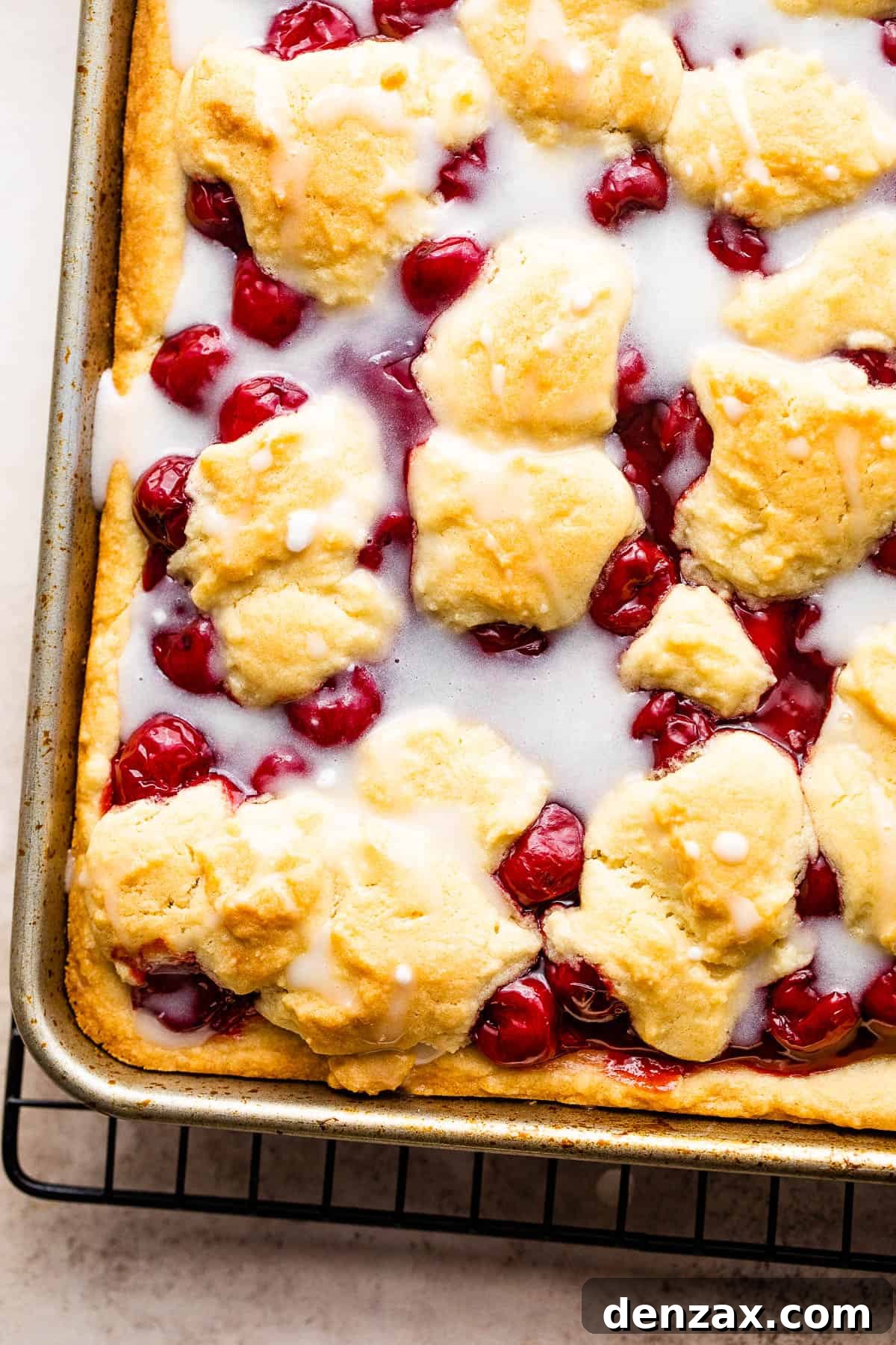 Cherry Kuchen Bars Recipe: Cherry Cake Bars with Streusel 6 A Pan of Cherry Kuchen Bars Drizzled with Homemade Icing