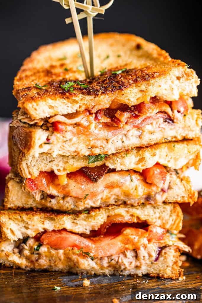 Crispy Tuna Melt Grilled Cheese Sandwich Recipe 2 halved tuna cheese sandwiches and stacked up one on top of the other