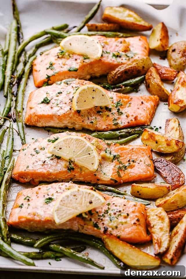 Simple, fresh, and flavorful, this baked salmon recipe with potatoes and green beans is one of my family's favorite sheet pan dinners. Enjoy! Pan lined with baked salmon