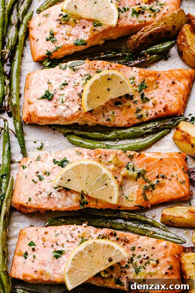 Oven-baked salmon topped with lemon slices. Oven-baked salmon topped with lemon slices.