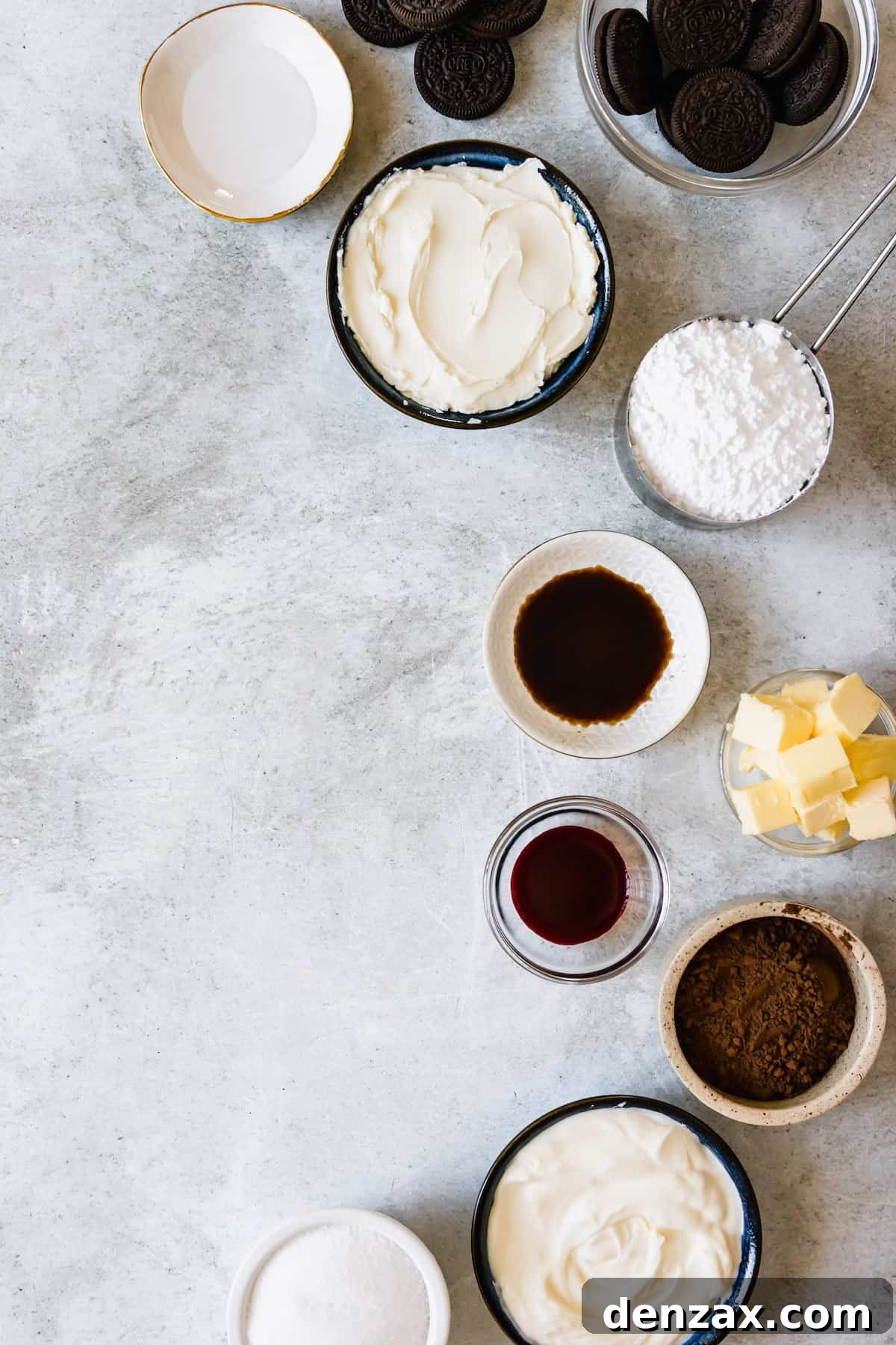 The Red Velvet Cheesecake Ingredients Assembled on a Light Gray Marble Counter