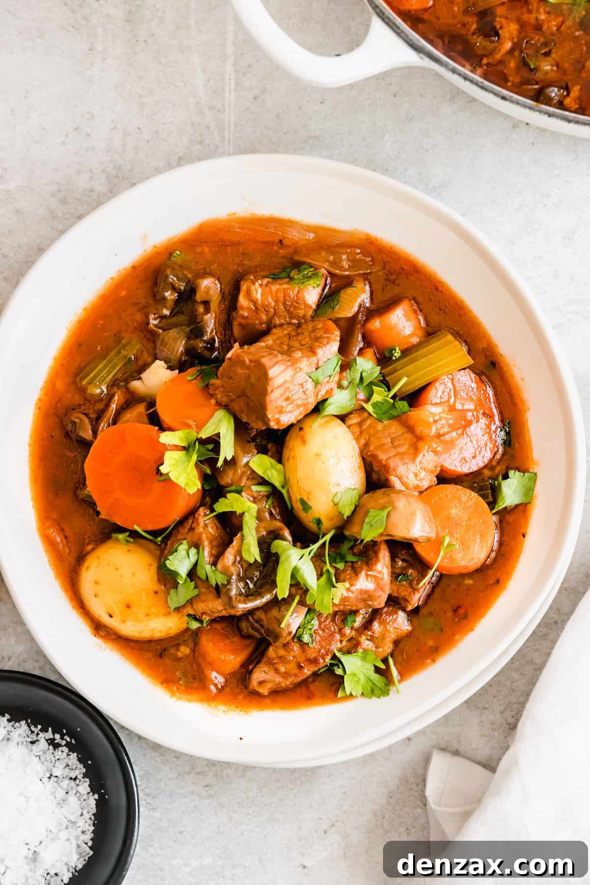 Rich Guinness Beef Stew Recipe for Comforting Dinner 3 A bowl of beef stew with potatoes and carrots.