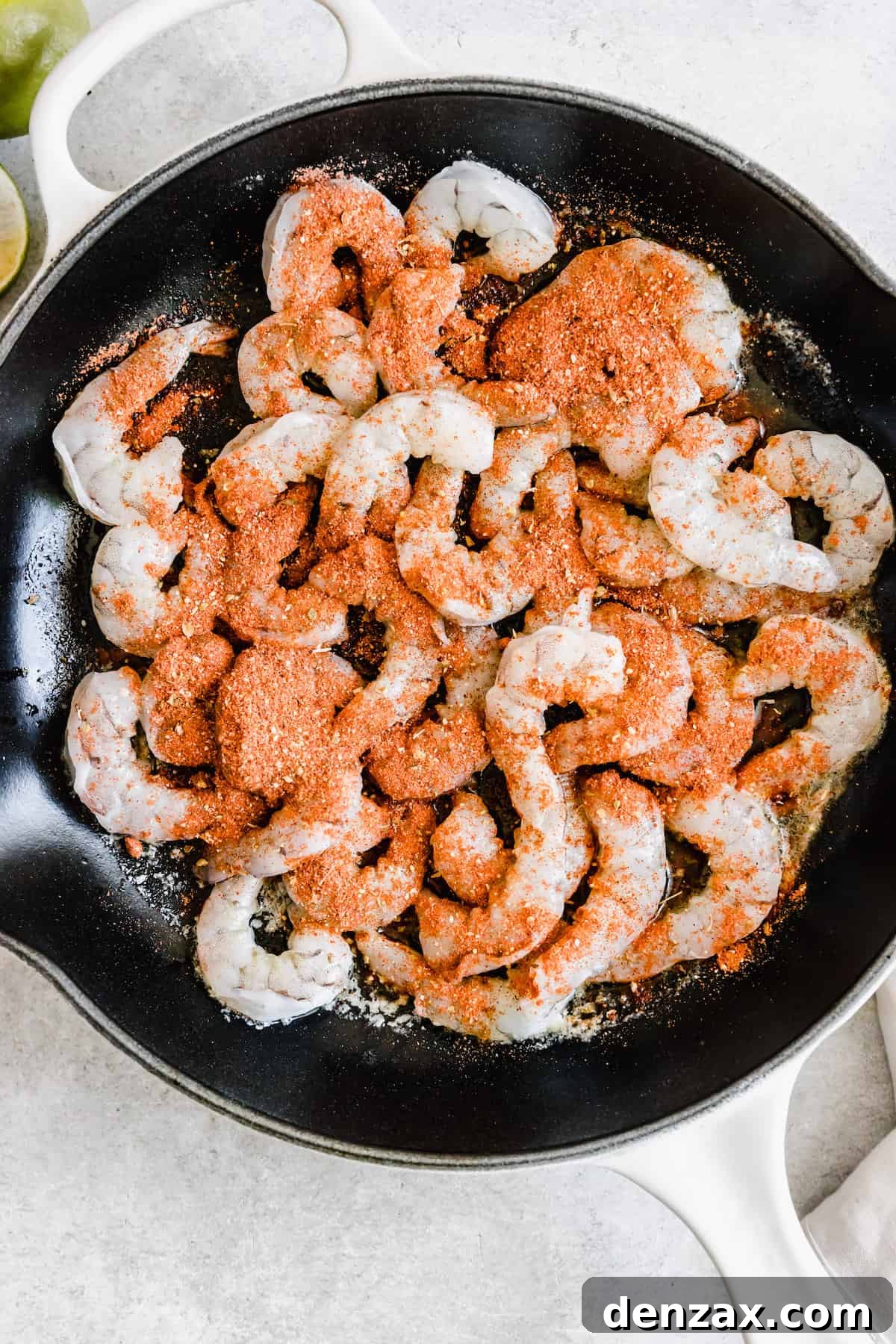 Seasoned Shrimp Inside of a Metal Skillet