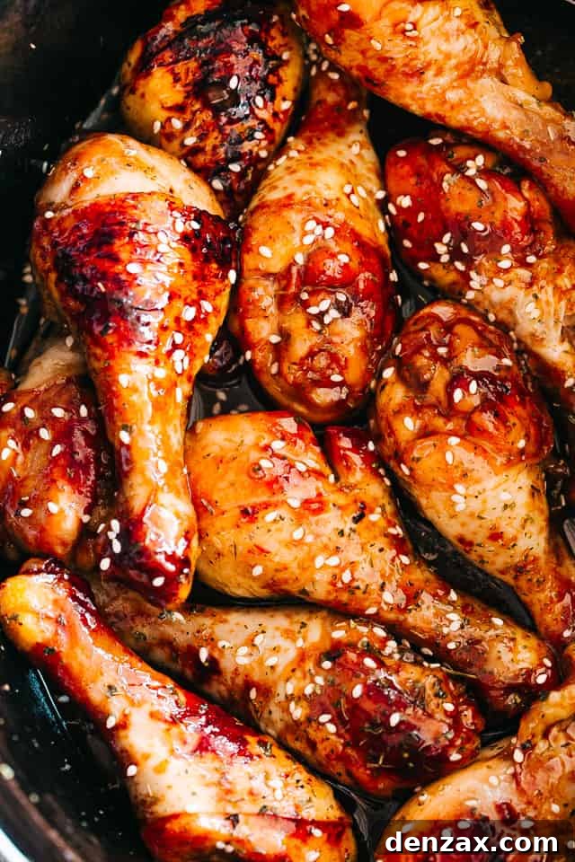 close up of chicken drumsticks glazed with honey sriracha sauce