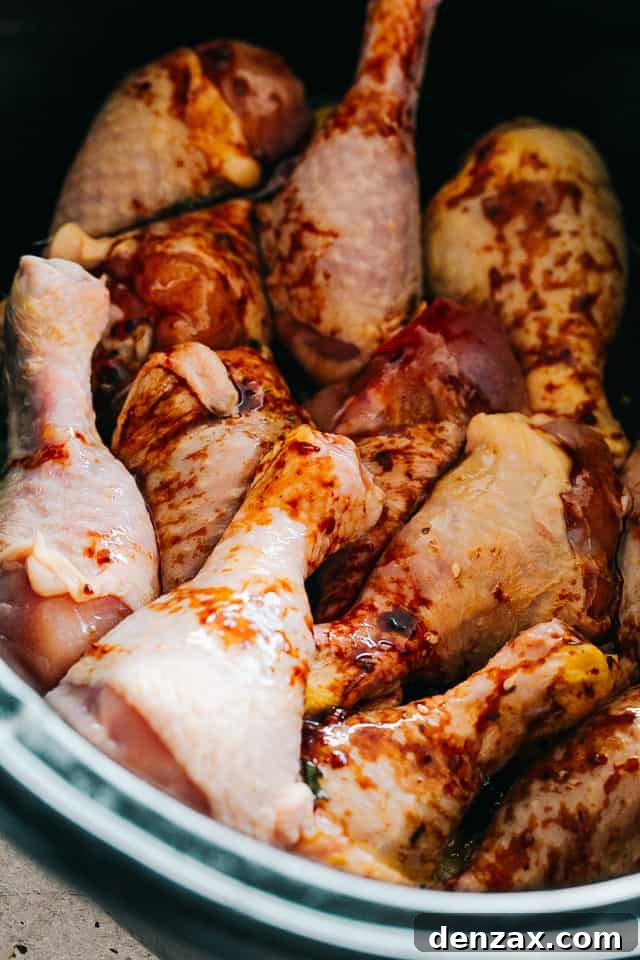 raw chicken legs in a slow cooker