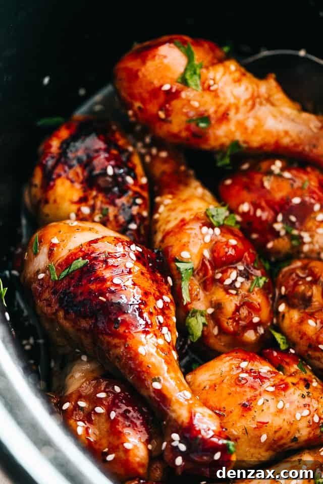 close up of chicken drumsticks glazed with honey sriracha sauce