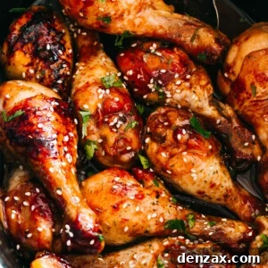 close up of chicken drumsticks glazed with honey sriracha sauce