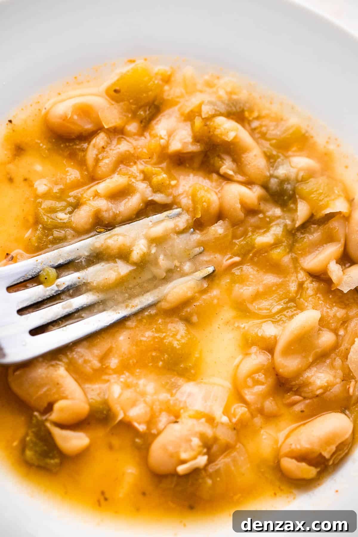 mashing beans with the back of a fork