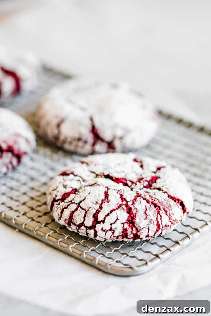 Four Red Velvet Cookies on Top of a Small Cooling Rack