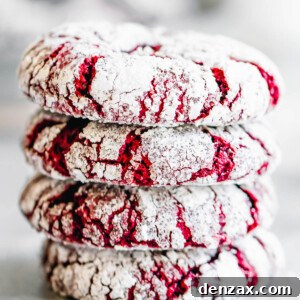 Four Crinkle Cookies Stacked on a Smooth White Surface