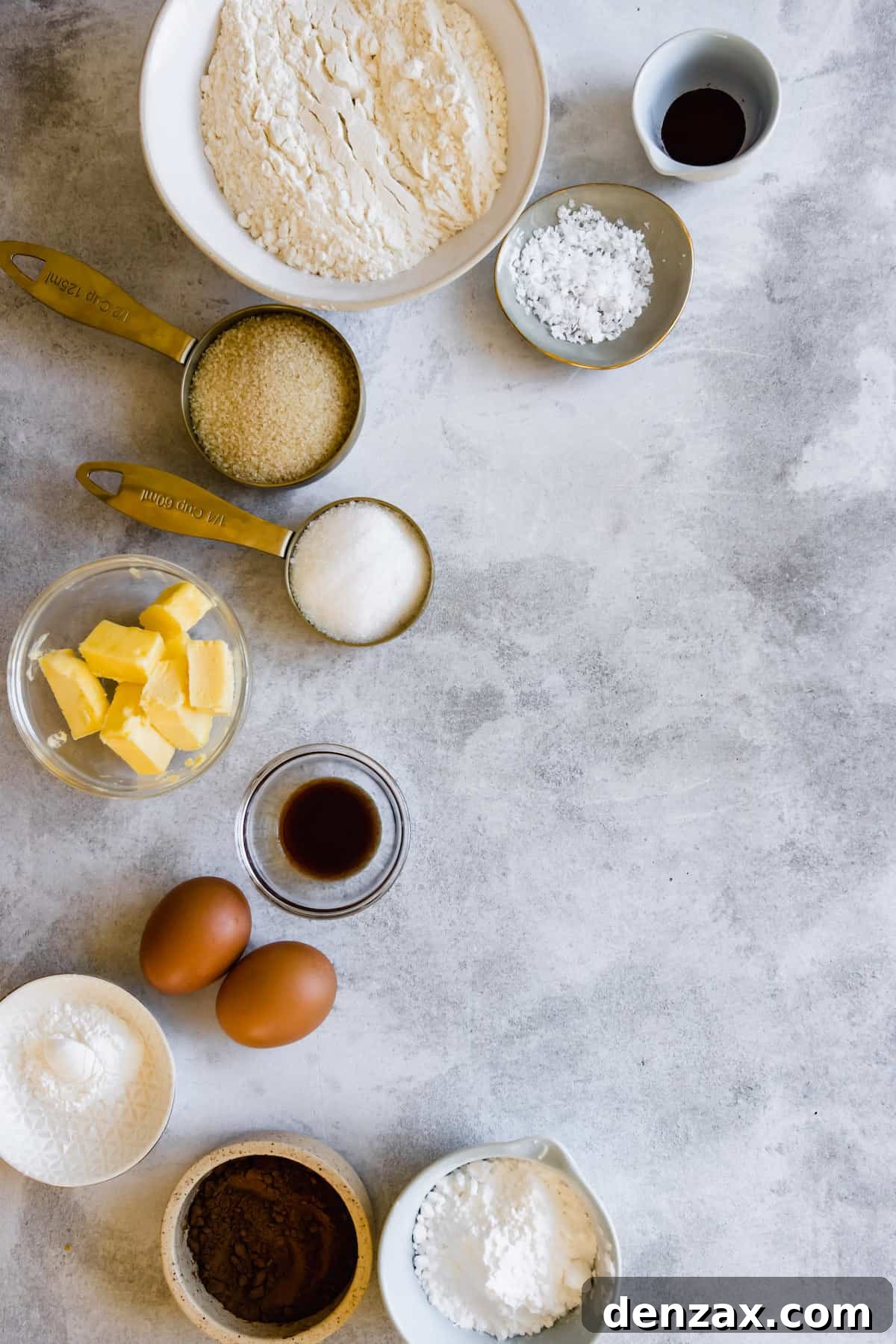 Eggs, Vanilla, Butter, Flour and the Remaining Cookie Ingredients on a Countertop