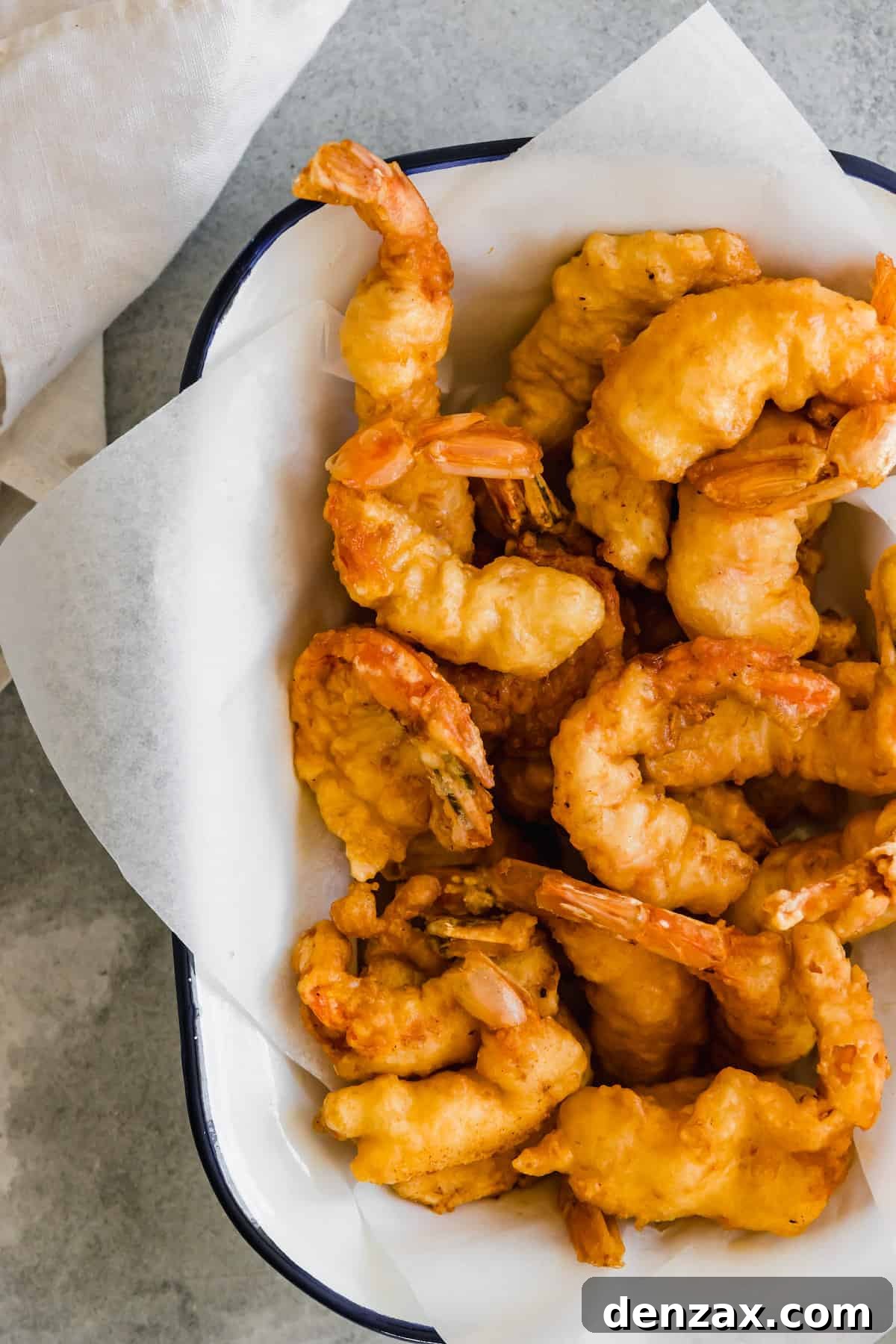 A Platter of Shrimp Tempura Lined with a Piece of Parchment Paper