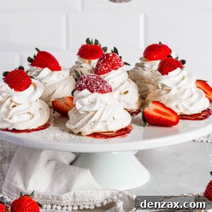 Sifting confectioners sugar onto pavlovas