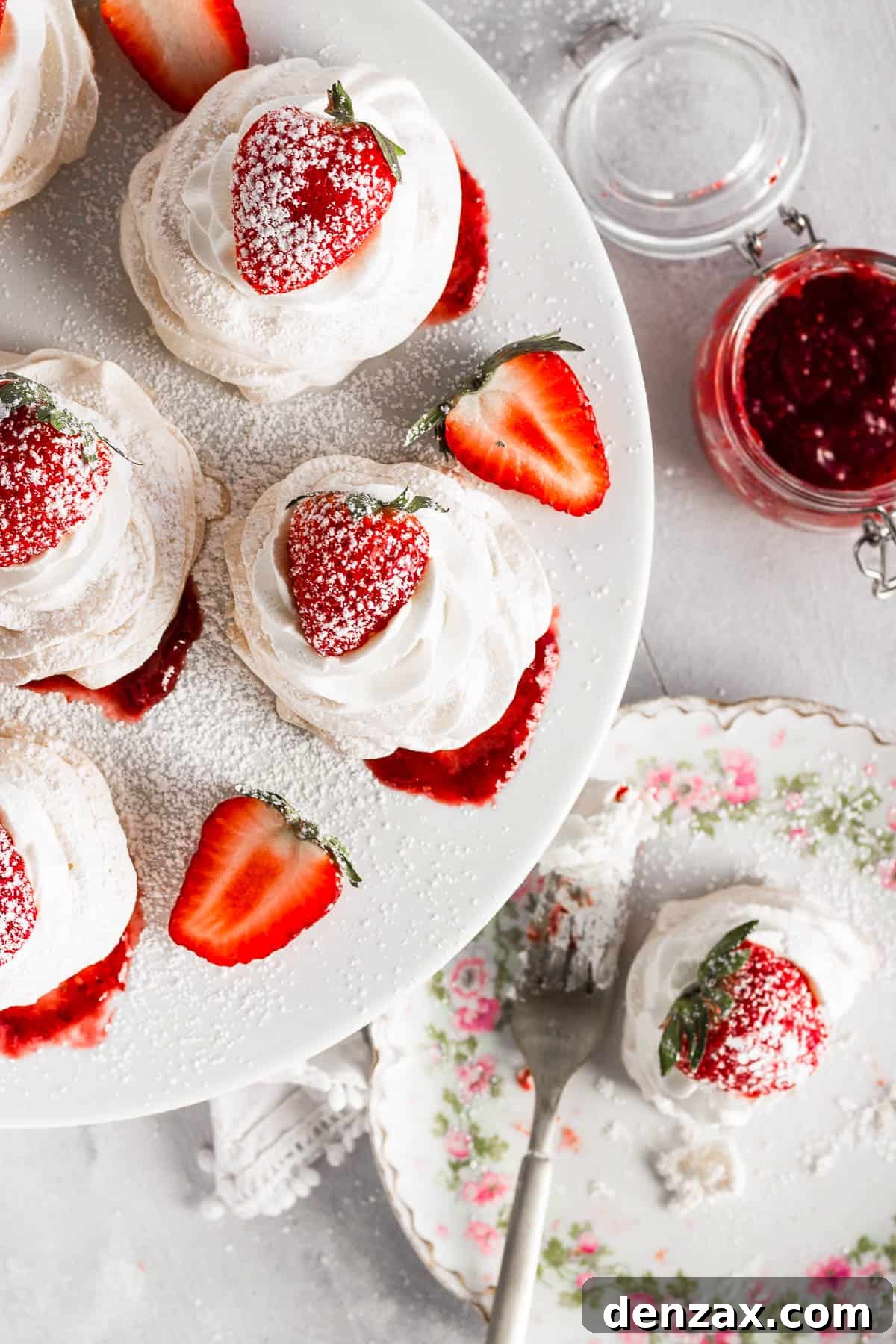 overhead shot of Pavlovas topped with strawberries and sugar