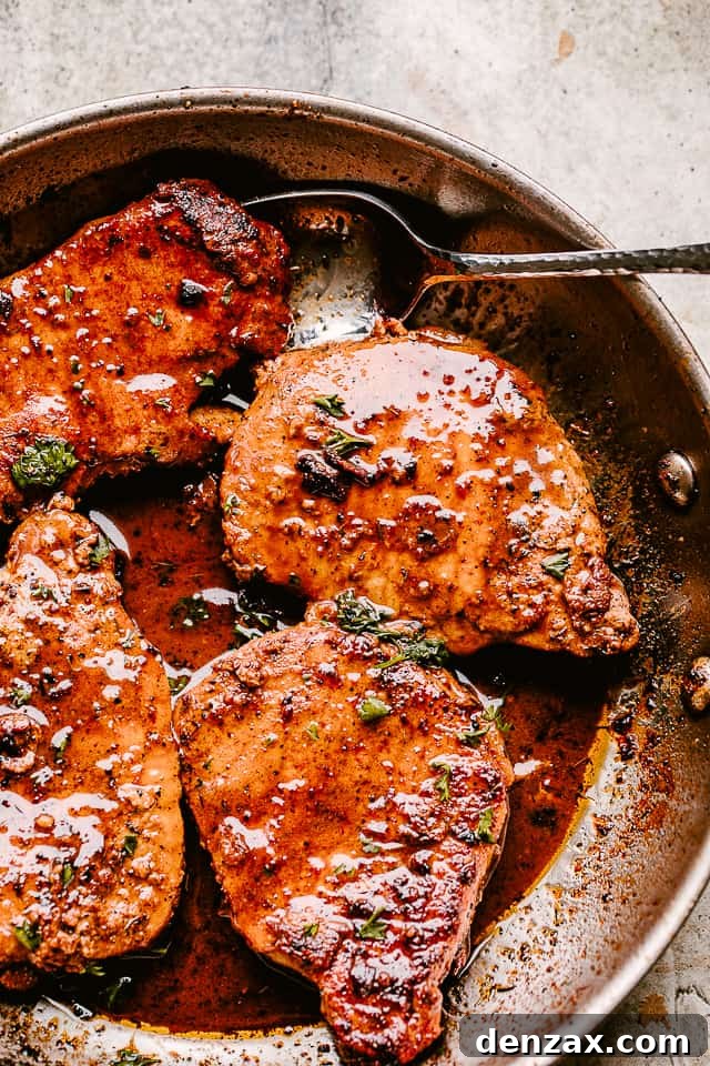 Skillet with pan fried pork chops