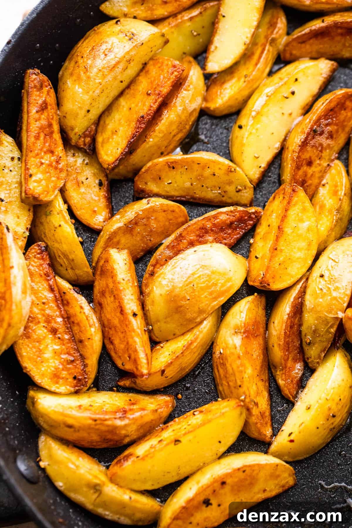 up close shot of quartered baby potatoes in a skillet
