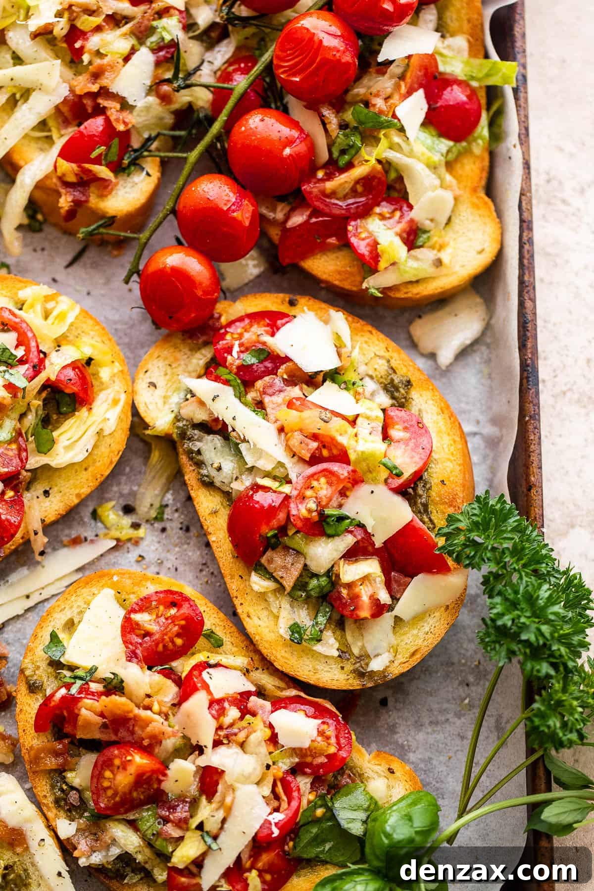toasted bread slices topped with tomatoes, bacon, and lettuce