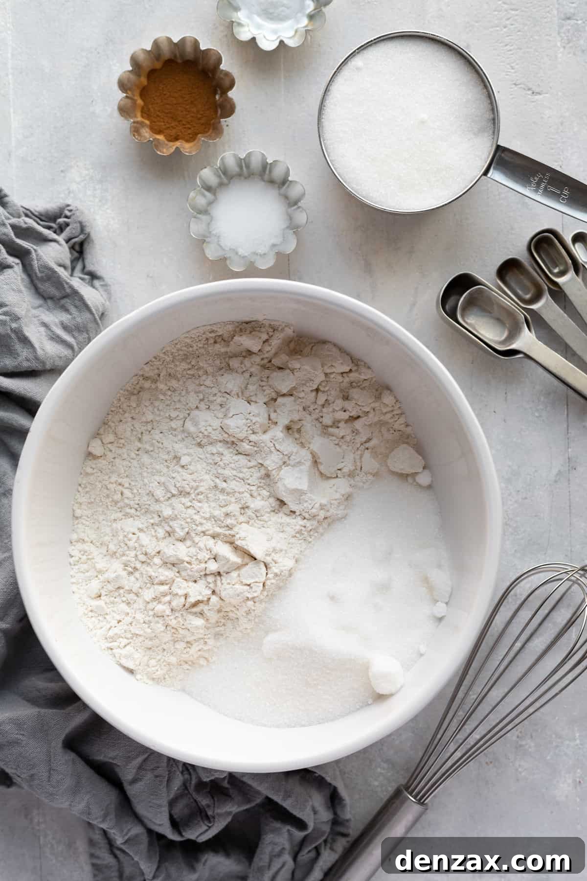 Sugar, Flour, Cinnamon and the Rest of the Dry Ingredients for The Cake on a Countertop