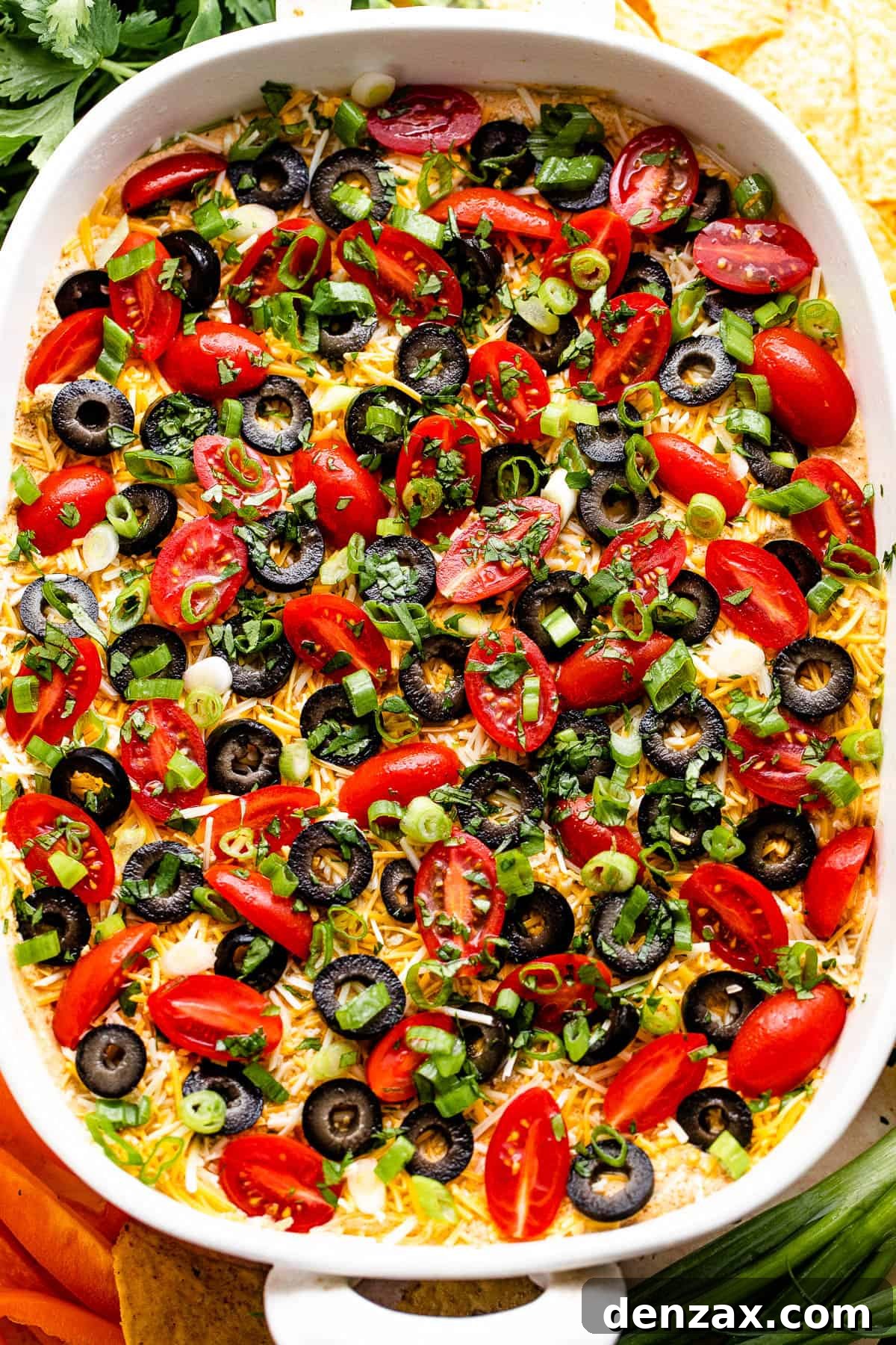 overhead shot of a white baking dish with seven layer mexican dip