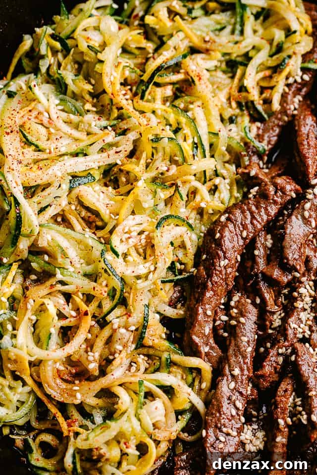 Close up of flank steak and zucchini noodles.