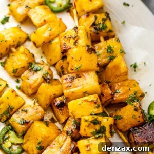 grilled tequila pineapple skewers served on a plate