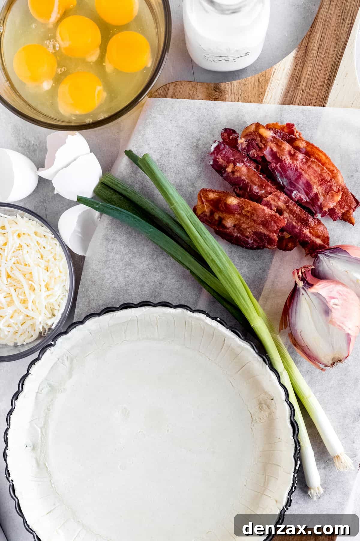 A Refrigerated Pie Crust, Bacon, Eggs, Shredded Swiss Cheese and the Remaining Quiche Ingredients