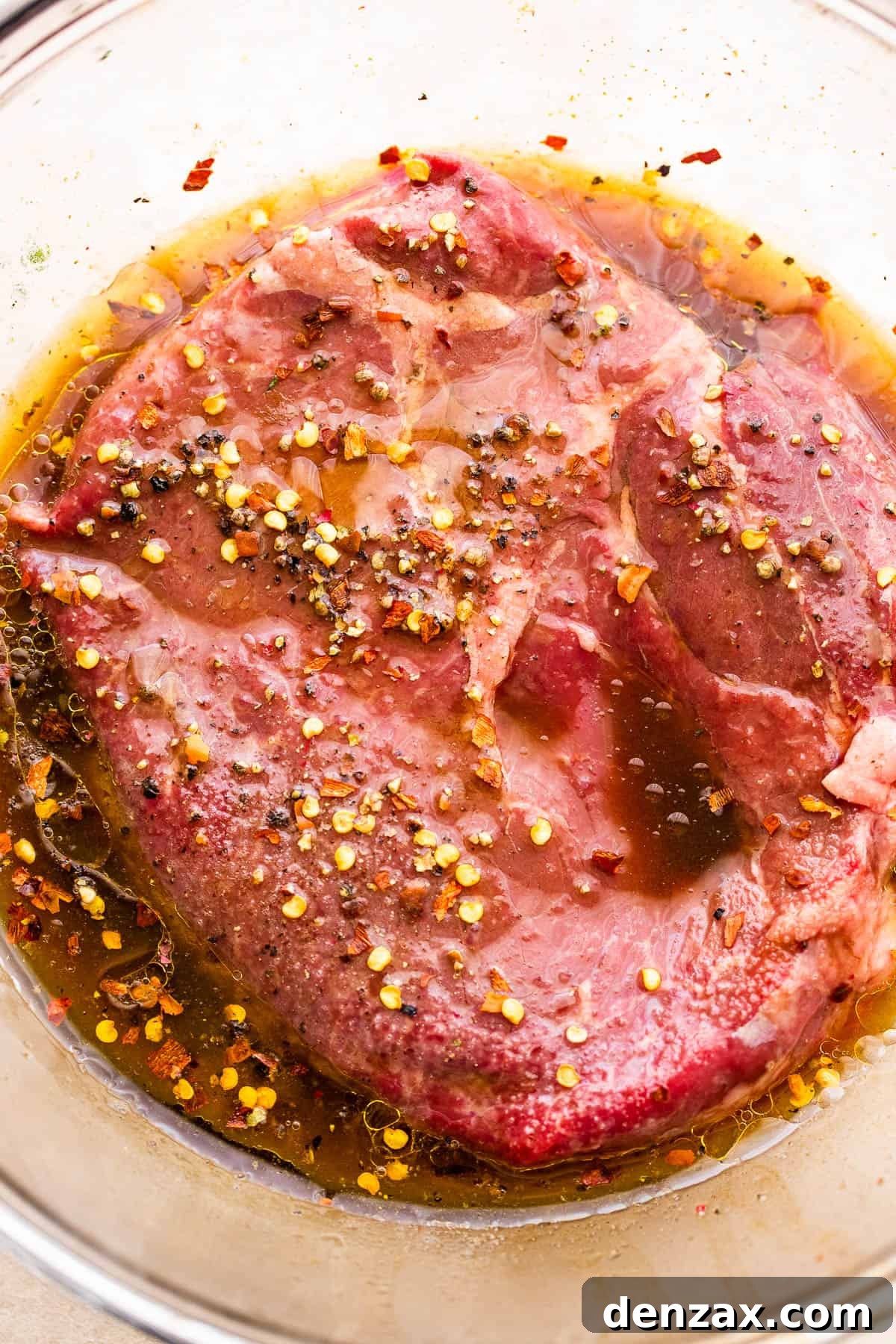 marinating steak in a glass bowl