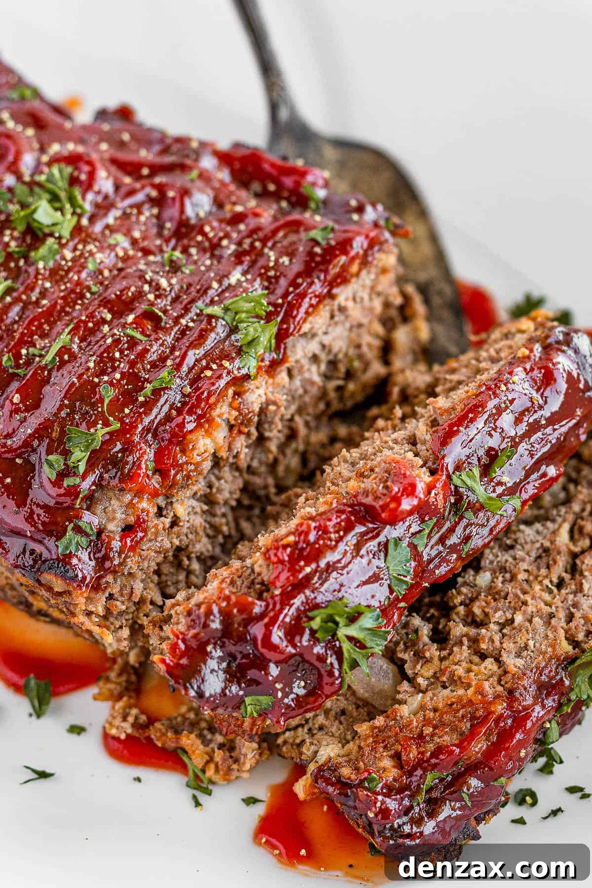 Meatloaf Covered in Barbecue Sauce on a White Serving Platter