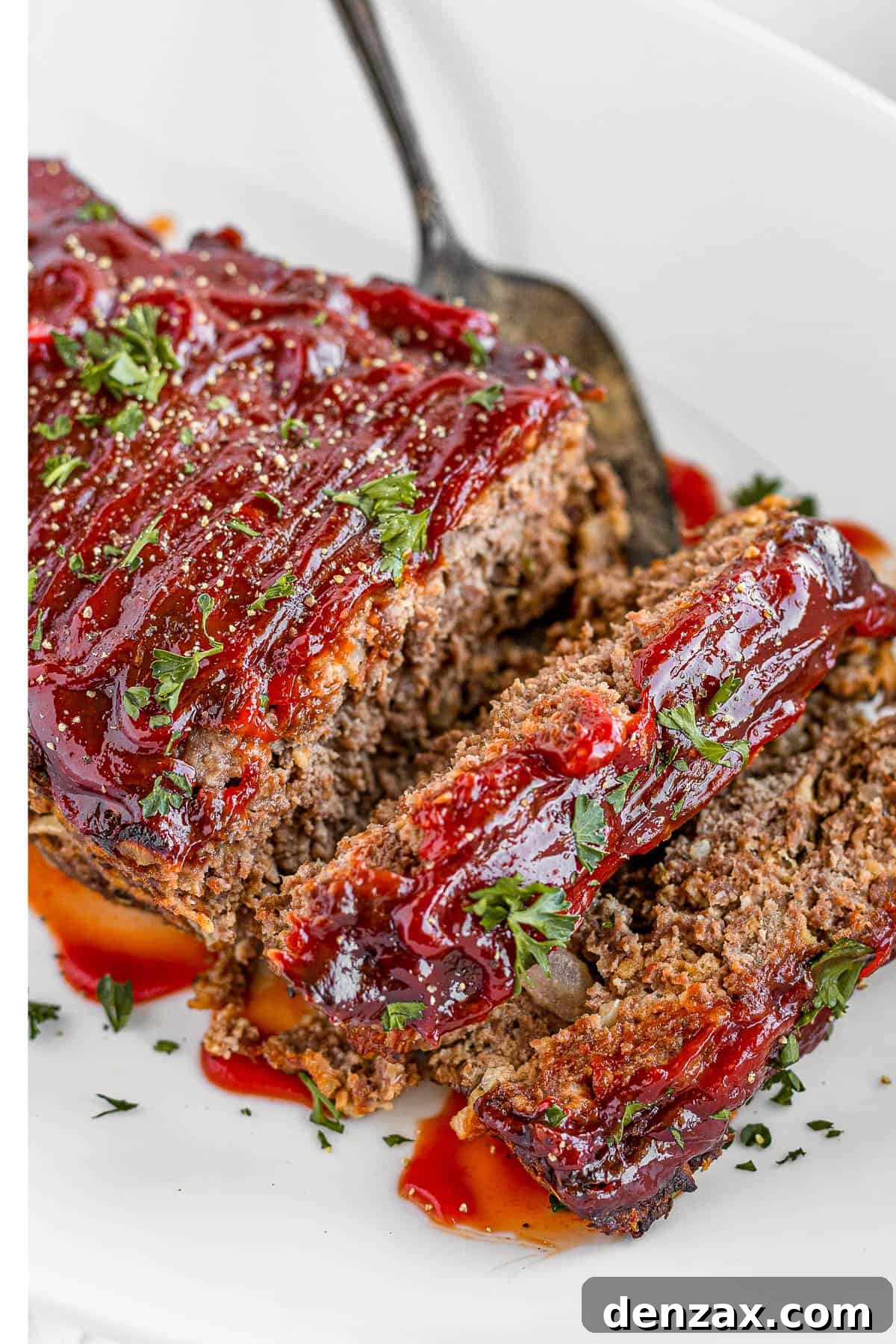 Meatloaf Covered in Barbecue Sauce on a White Serving Platter