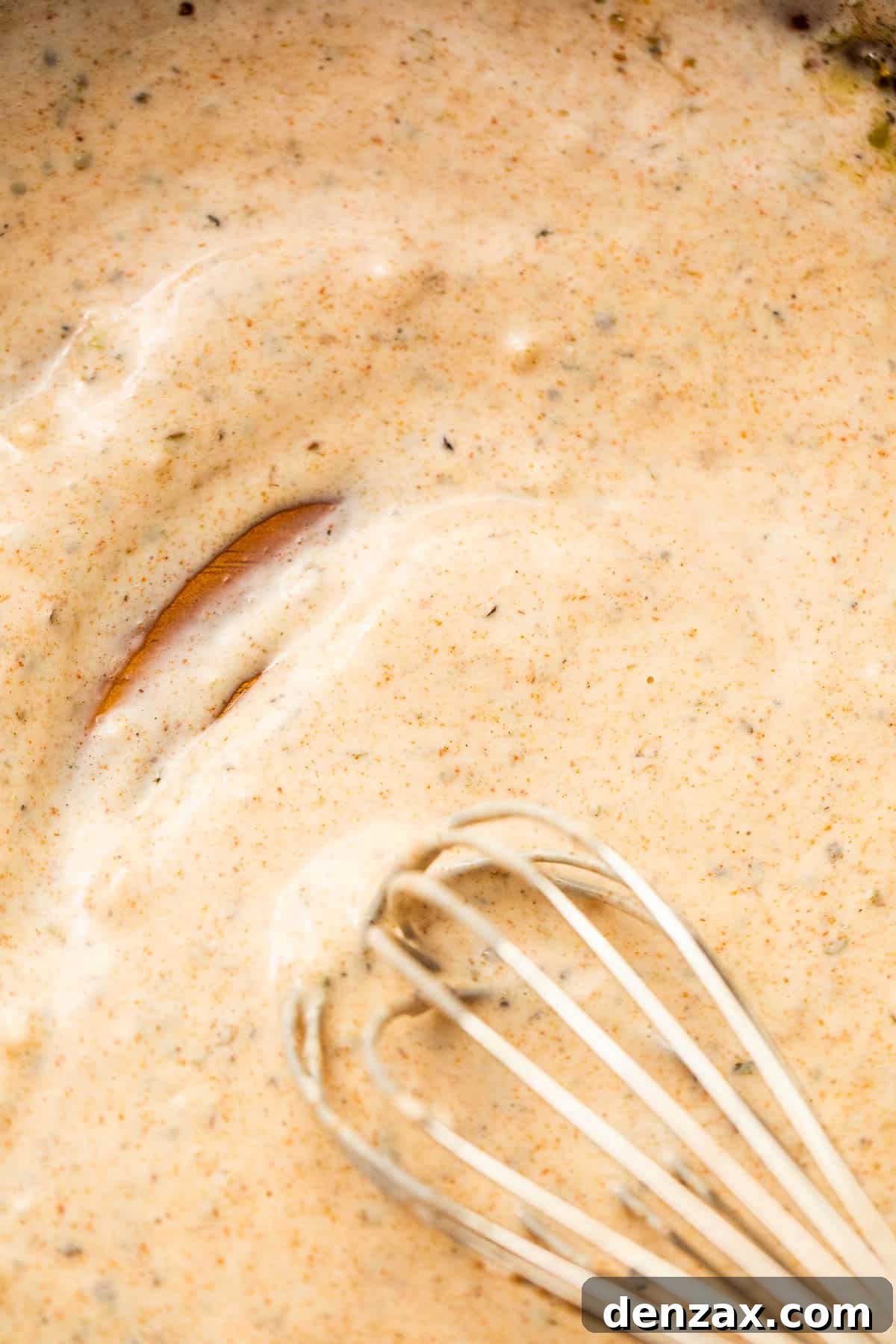 whisking creamy dressing