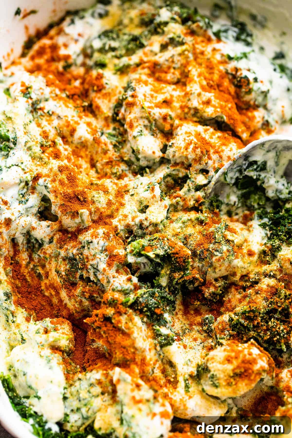 mixing chicken and spinach with sour cream and mayonnaise
