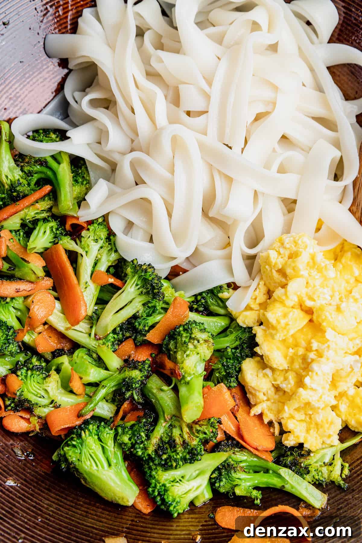 A Bowl of Cooked Rice Noodles, Eggs and Vegetables