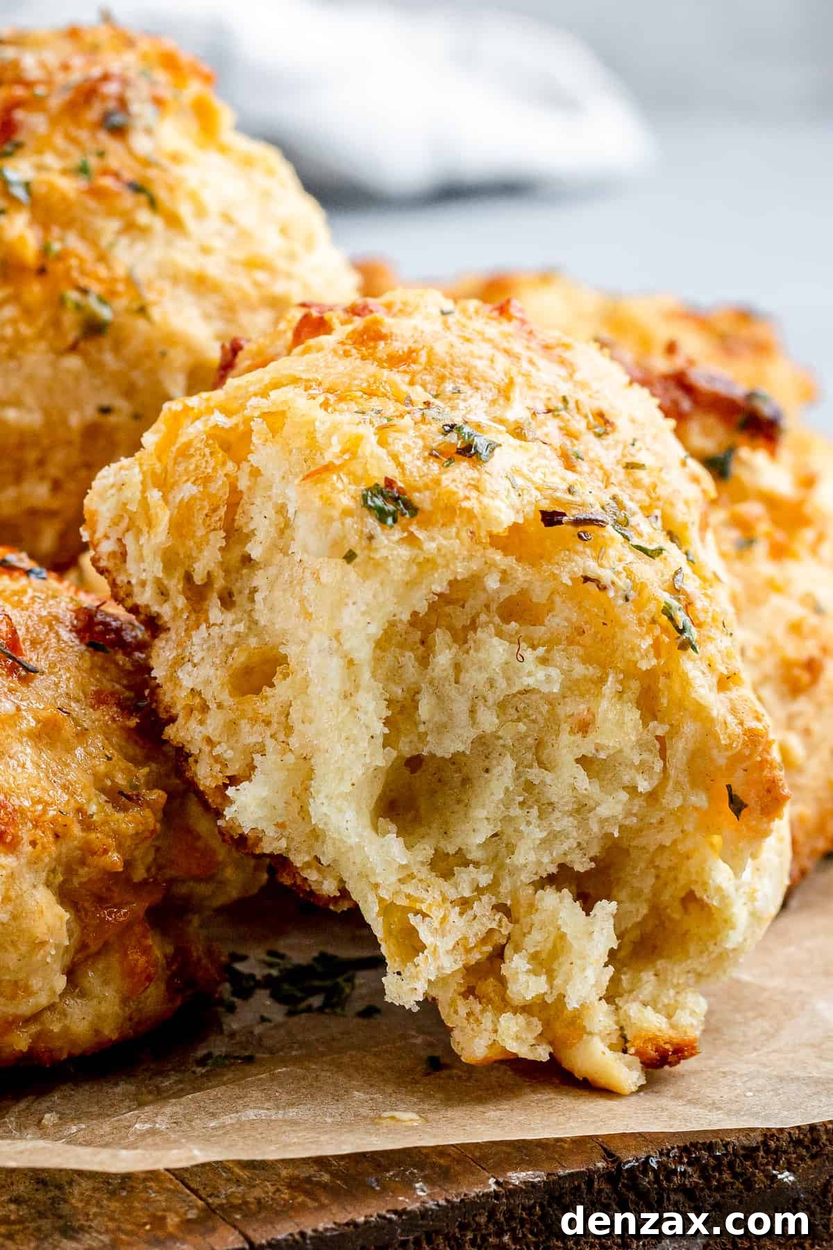 An Air Fryer Red Lobster Biscuit with a Bite Taken Out to Reveal the Fluffy Interior