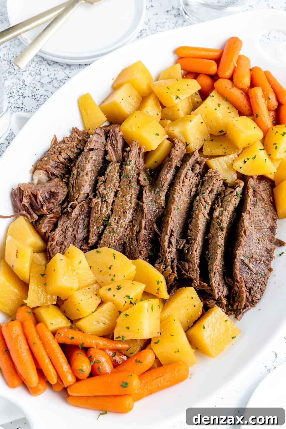 Pot roast, potatoes and carrots on a plate