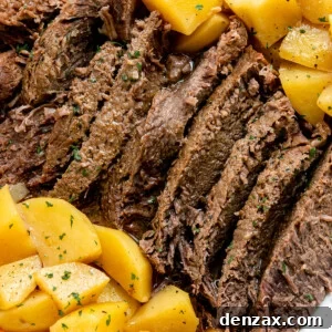 Pot roast with potatoes on a white plate