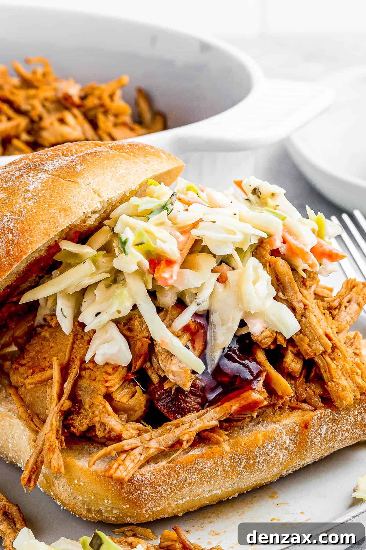 sandwich buns with pulled pork topped with coleslaw