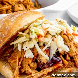 sandwich buns with pulled pork topped with coleslaw