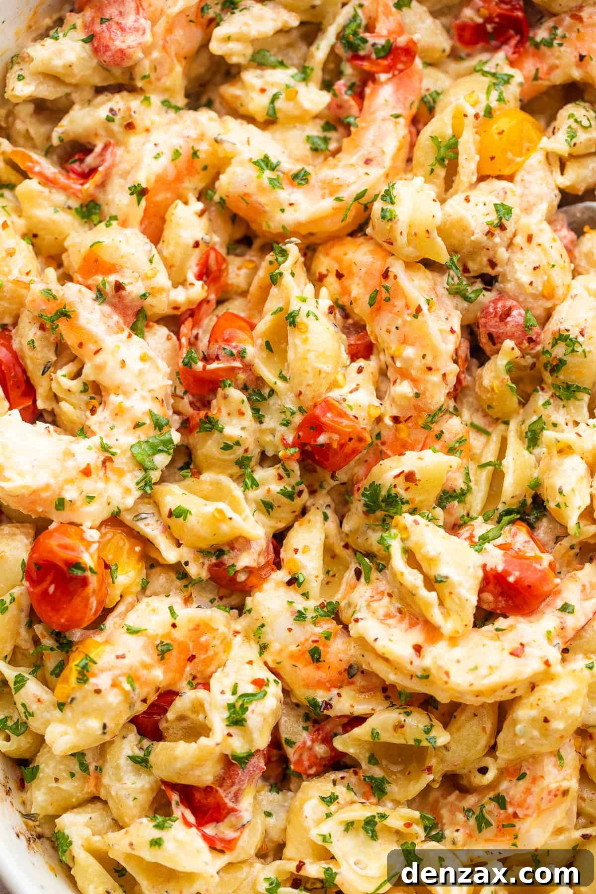 shrimp and pasta tossed with a cream cheese sauce and cherry tomatoes