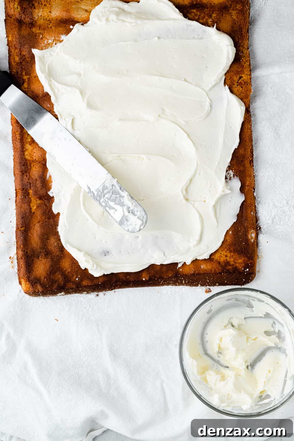 An unrolled pumpkin roll cake spread with filling