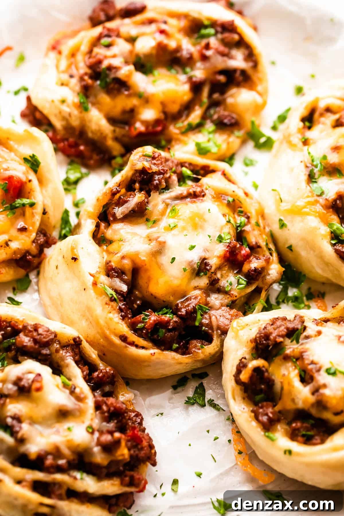 taco pinwheels served on a white background.