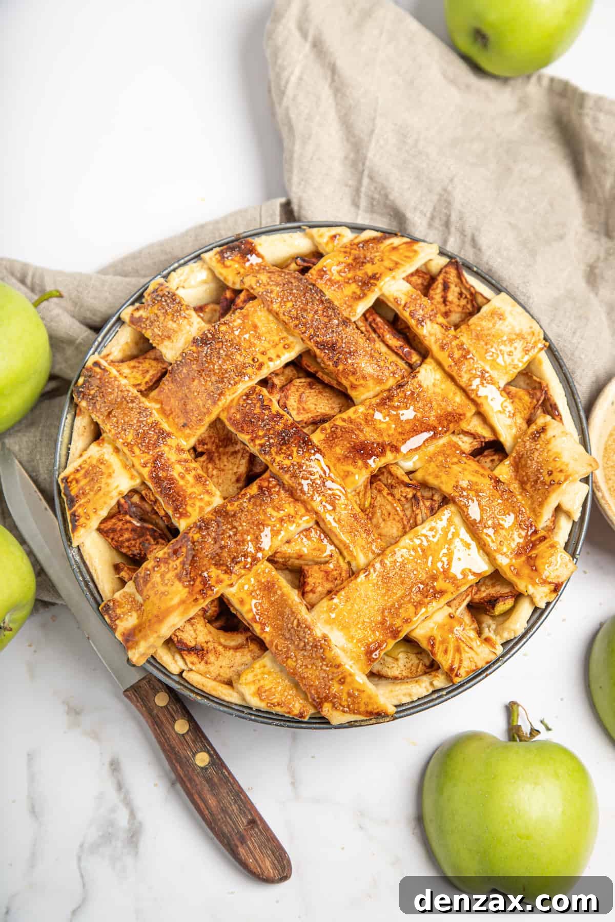 A homemade apple pie with a lattice top.
